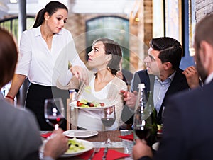 Angry couple conflict with waitress