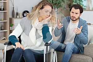 angry couple fighting sitting on couch at home