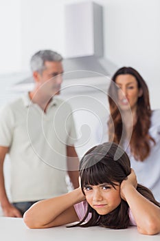 Angry couple having dispute in front of their daughter