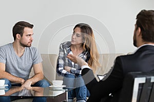 Angry couple looking at each other taking therapy session