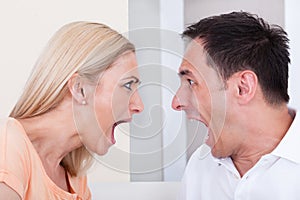 Angry couple shouting at each other