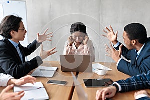 Angry Coworkers Shouting At Female Colleague During Meeting In Office