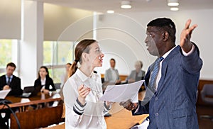 Angry director kicks delinquent female manager out of meeting room photo