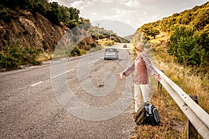 Angry and disappointed woman hitchhiker