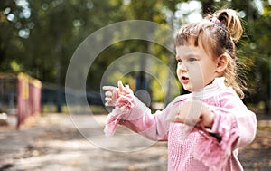 Angry displeased and distressed little girl, the child looks furious and upset. active holidays in autumn