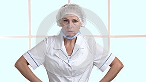 Angry doctor on clinic window background.