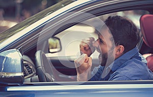 Angry driver with fists up screaming