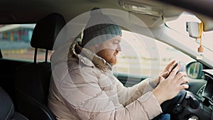 Angry driver in a traffic jam. He screams and gesticulates,