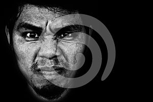 Angry face of man on black background