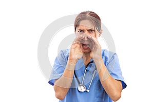 Angry female nurse or doctor screaming with hands on mouth