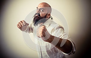 Angry fighter long beard and mustache man