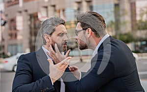 angry fighting businessmen have business conflict. photo of businessmen have business conflict.