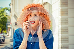 Angry frustrated, red curly hair woman talking on mobile phone