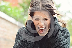 Angry furious woman screaming with rage