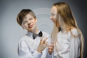 Angry girl shouting at frightened dissatisfied boy. Negative human emotion, facial expression. Closeup. Communication