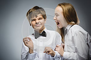 Angry girl shouting at frightened dissatisfied boy. Negative human emotion, facial expression. Closeup. Communication