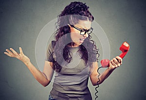 Angry girl speaking on phone and yelling