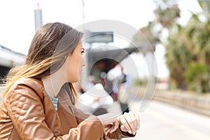 Angry girl waiting in a train station