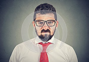 Angry grumpy man looking very displeased