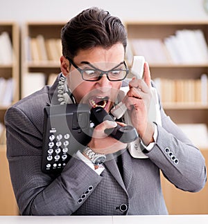 Angry helpdesk operator yelling in office