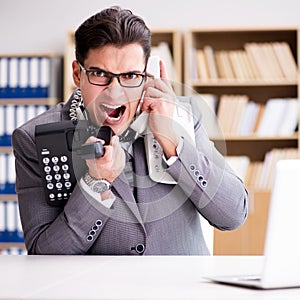 Angry helpdesk operator yelling in office