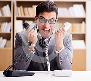 Angry helpdesk operator yelling in office