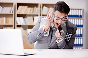 The angry helpdesk operator yelling in office