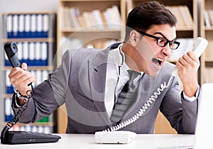 Angry helpdesk operator yelling in office
