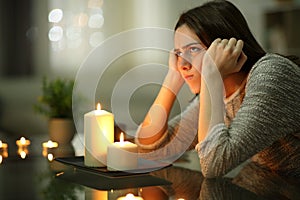 Angry homeowner using candles during power outage