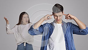 Angry irritated nervous woman shouting at male, figuring out relations, feeling outraged, relationship problems photo