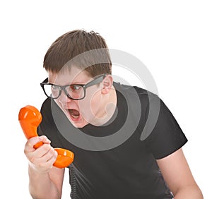 Angry and kid screams into the telephone