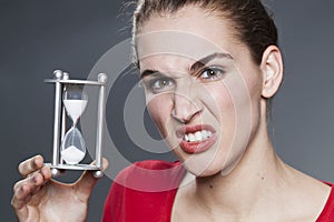 Angry lady with timer and eye brows raised