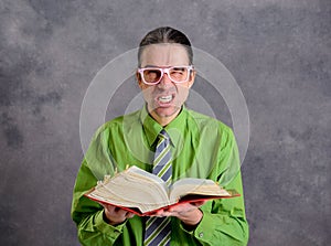 Angry lawyer with statute book and pink glasses