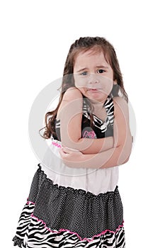 Angry little girl with arms crossed