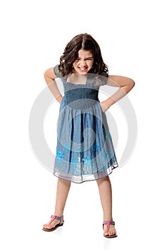 Angry little girl in blue dress