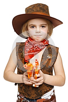 Angry little girl cowboy holding guns