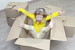 angry little girl doesn't want to crawl into a new apartment.