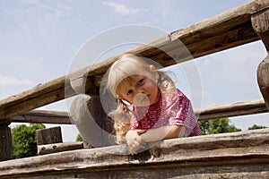 Angry little girl on the playground