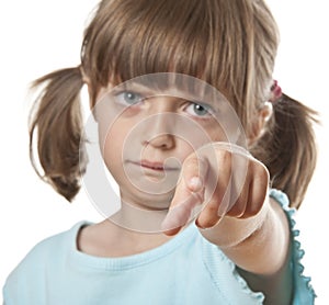 Angry little girl pointing on you