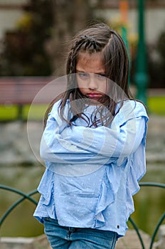 Angry little girl showing frustration and disagreement