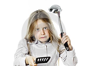 Angry little girl with soup ladle