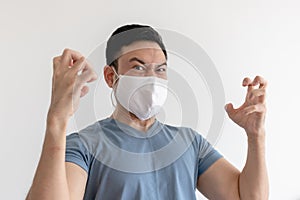 Angry and mad man in face mask on isolated white background.