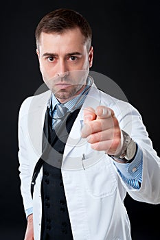 Angry male doctor pointing at you