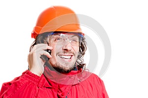 Angry Man architector or builder speaking on mobile over white background