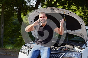 Angry man with a broken car