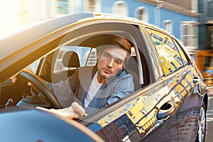 Angry man at car in traffic jam