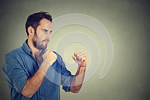 Angry man clenching his fists