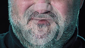 Angry man.Closeup mouth of man with crooked teeth. Unshaven aggressive man