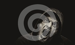 Angry man on a dark background