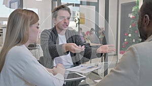 Angry Man Discussing Paperwork in Office, Argument